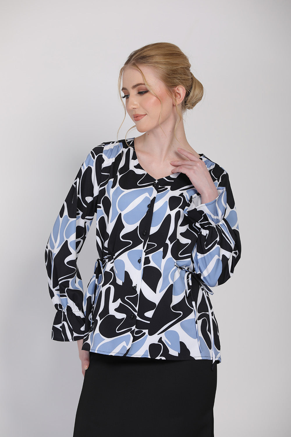 The Ceria Women Abstract Print Blouse